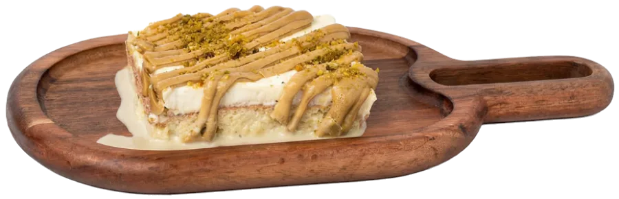 Pistachio milk cake on a wooden board